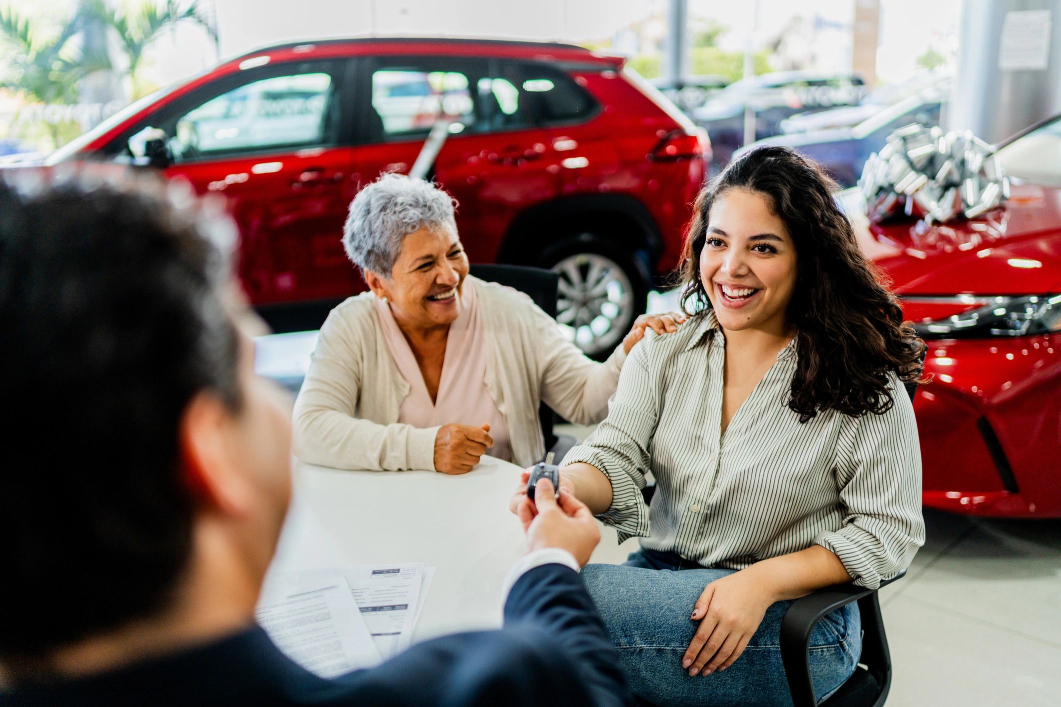 Customer receiving keys after vehicle service