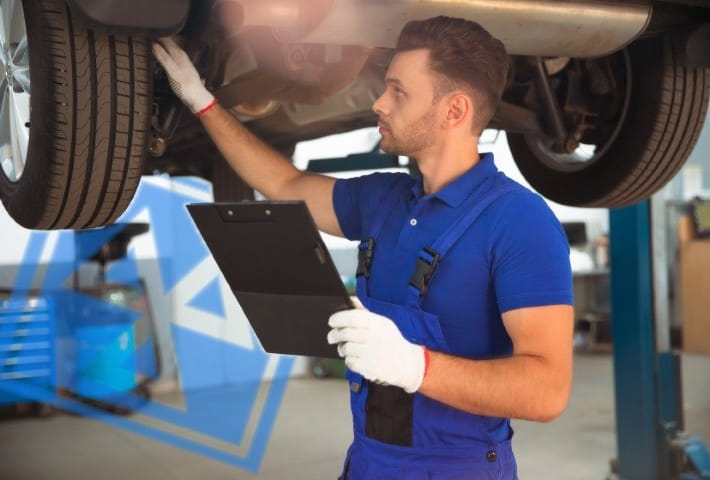 Confident, concentrated mechanic working in the workshop
